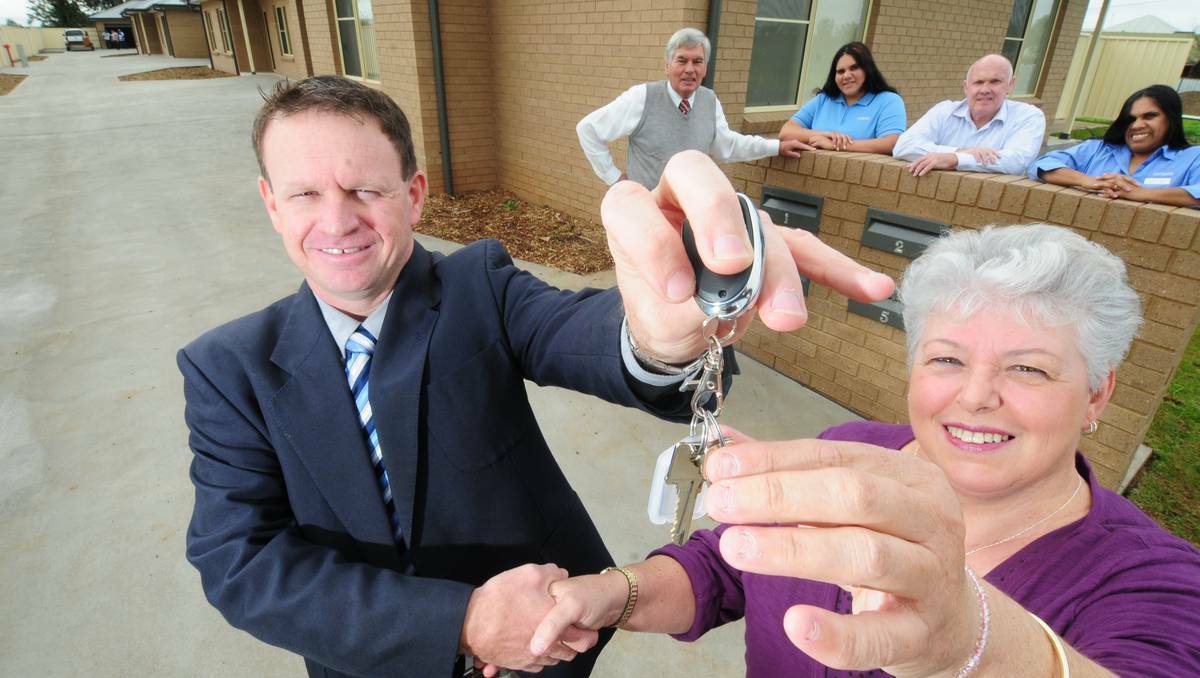 Compass Housing Services manager Angus Ridge handing the keys to new tenant Robyn Harland with Cr bill Keyy, Kiesha Walford, Ron Watson and Katy Jasper look on. Picture: Louise Donges