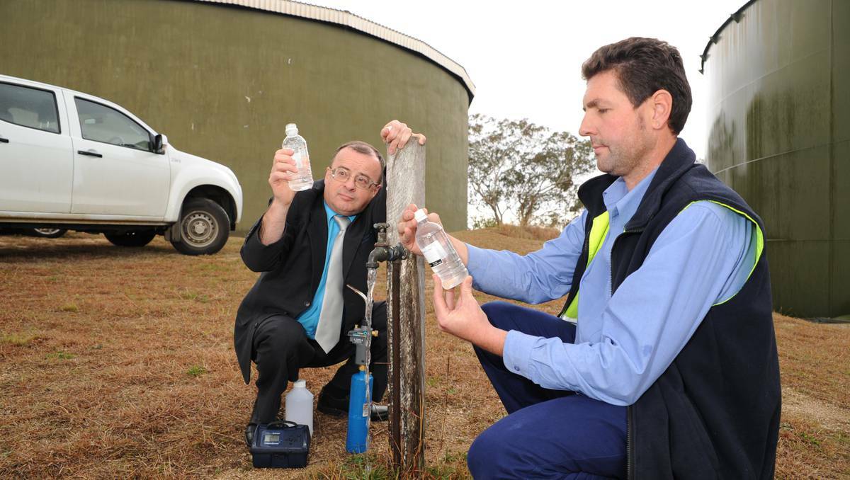 TESTING TIMES: Bathurst Regional Council general manager David Sherley and water supply supervisor David Cashen take water samples yesterday at the Suttor Street reservoir to be analysed by an independent lab. Photo: Zenio Lapka