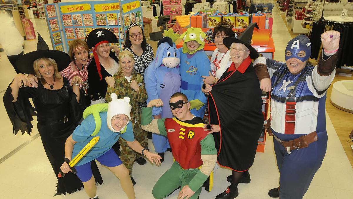 ON TARGET: Target Bathurst branch manager, Lisa Morrison, aka Captain America on the right, with fellow staff dressed up as storybook characters involved in Target's Australia's Biggest Toy Sale. Picture: Chirs Seabrook