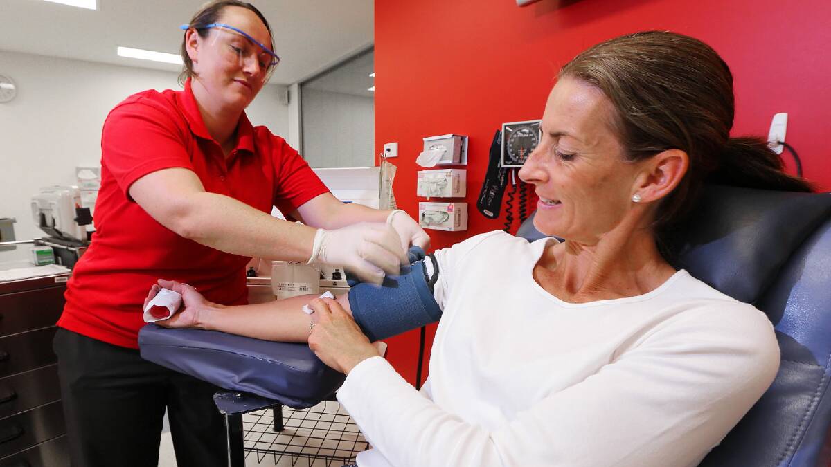 Kerri Yensch gives her 36th donation, with the Red Cross’ Laura Gibson on hand. Picture: JOHN RUSSELL