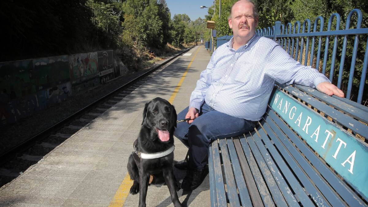 Jim Dunn, with Bart, wants free train travel for  vision-impaired passengers. Picture: TARA GOONAN