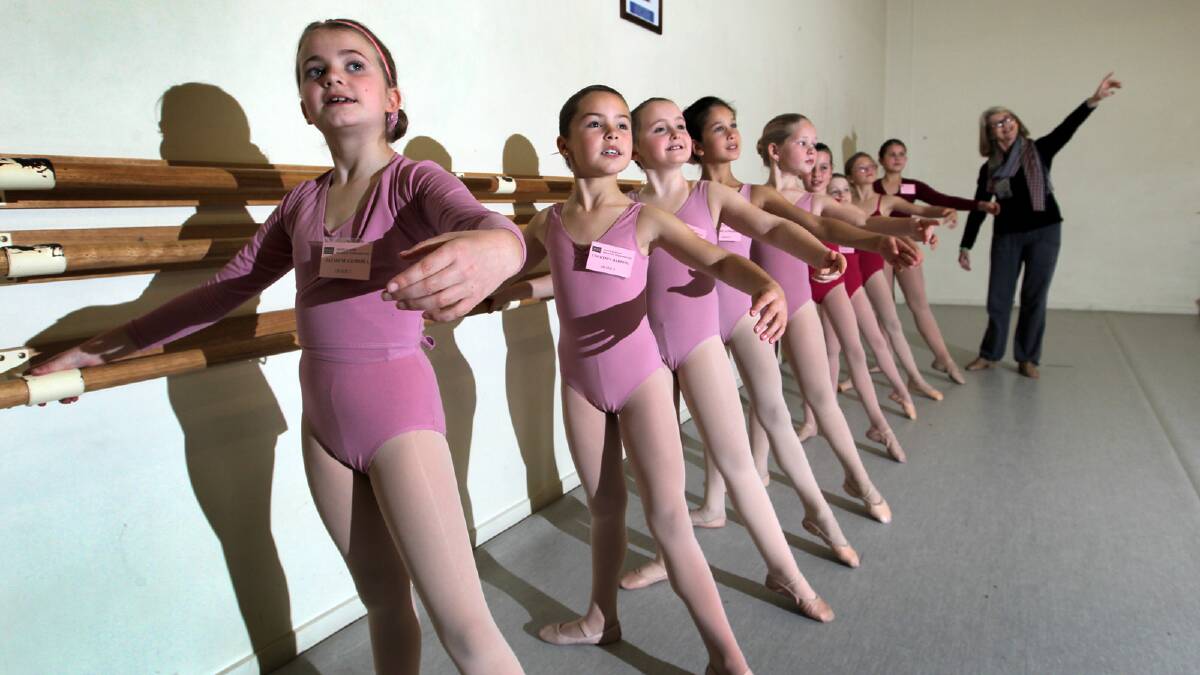 Jazmyne Gemmill, 9, and Courtney Harding, 9, both from Albury, practise with other dancers under the eye of Daphne Turnbull. Picture: DAVID THORPE