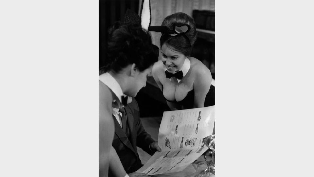 11th February 1963:  Bunny Girls taking an order in a club restaurant.  