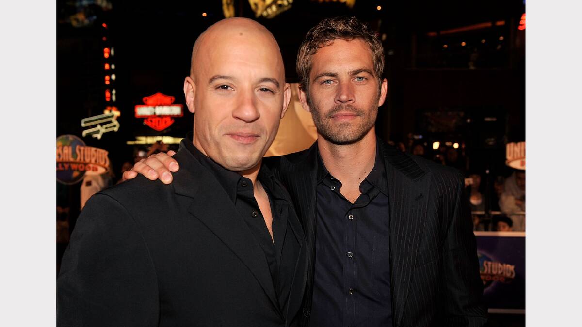  Vin Diesel (L) and Paul Walker arrive at the premiere Universal's "Fast & Furious" held at  Universal CityWalk Theaters on March 12, 2009 in Universal City, California.  (Photo by Kevin Winter/Getty Images)	