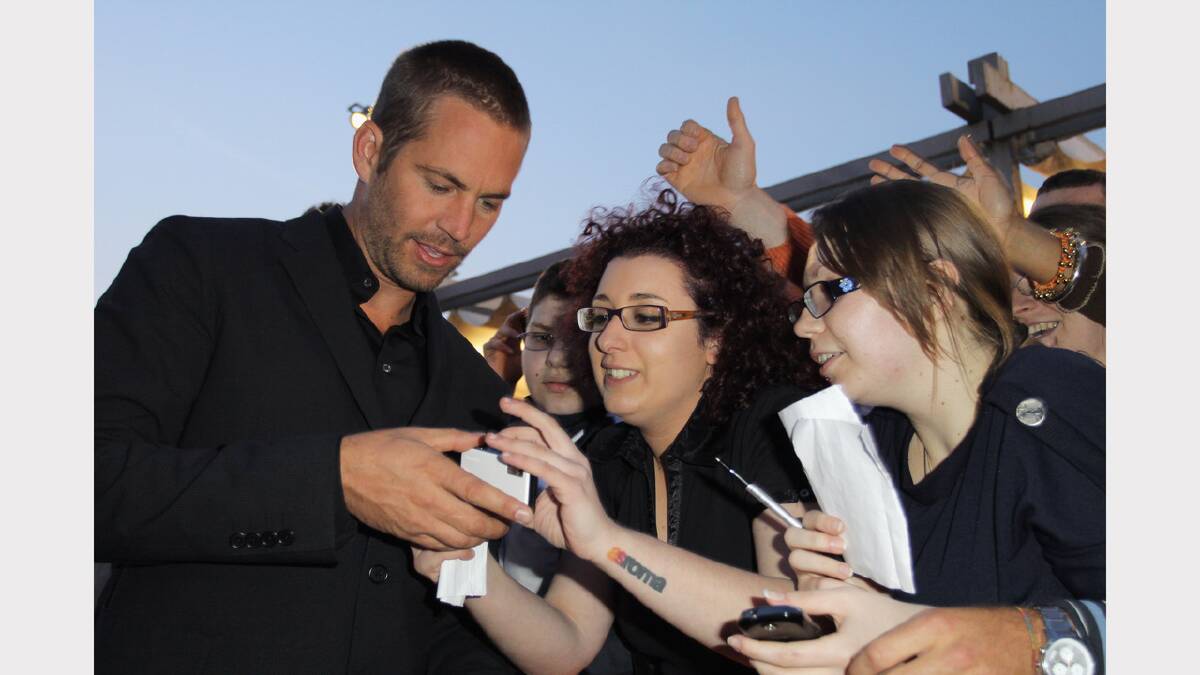  Walker signs autographs at the "Fast & Furious 5" premiere at UGC Cinema on April 29, 2011 in Rome, Italy.  