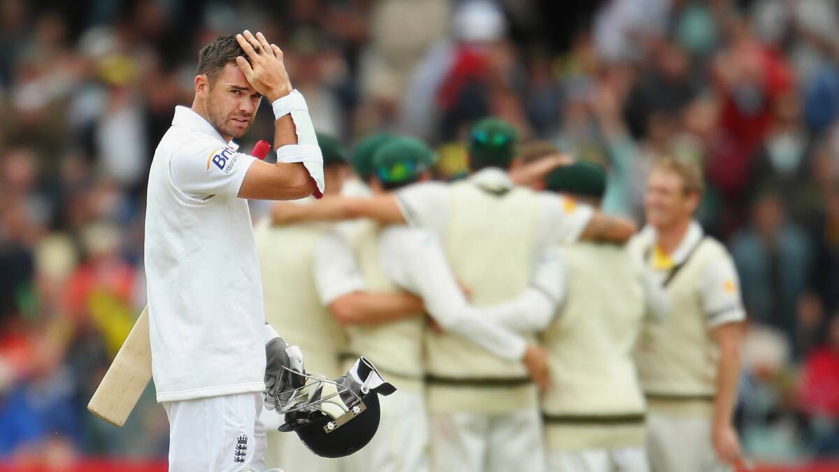 James Anderson of England looks on as Australia celebrate their victory. Picture: GETTY IMAGES