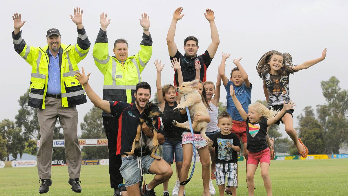 There’s fun in store for council ranger Matt Foster, compliance leader Craig McClanahan, Raiders’ Kyle Maynard, (front row) Raiders’ Jack Melrose, with kelpie Lexus, Jordan and Courtney Harding, with golden retriever Mambo, Indie, Banjo and Wil Conway, Chelsea Harding, and Charli Conway. Picture: TARA GOONAN