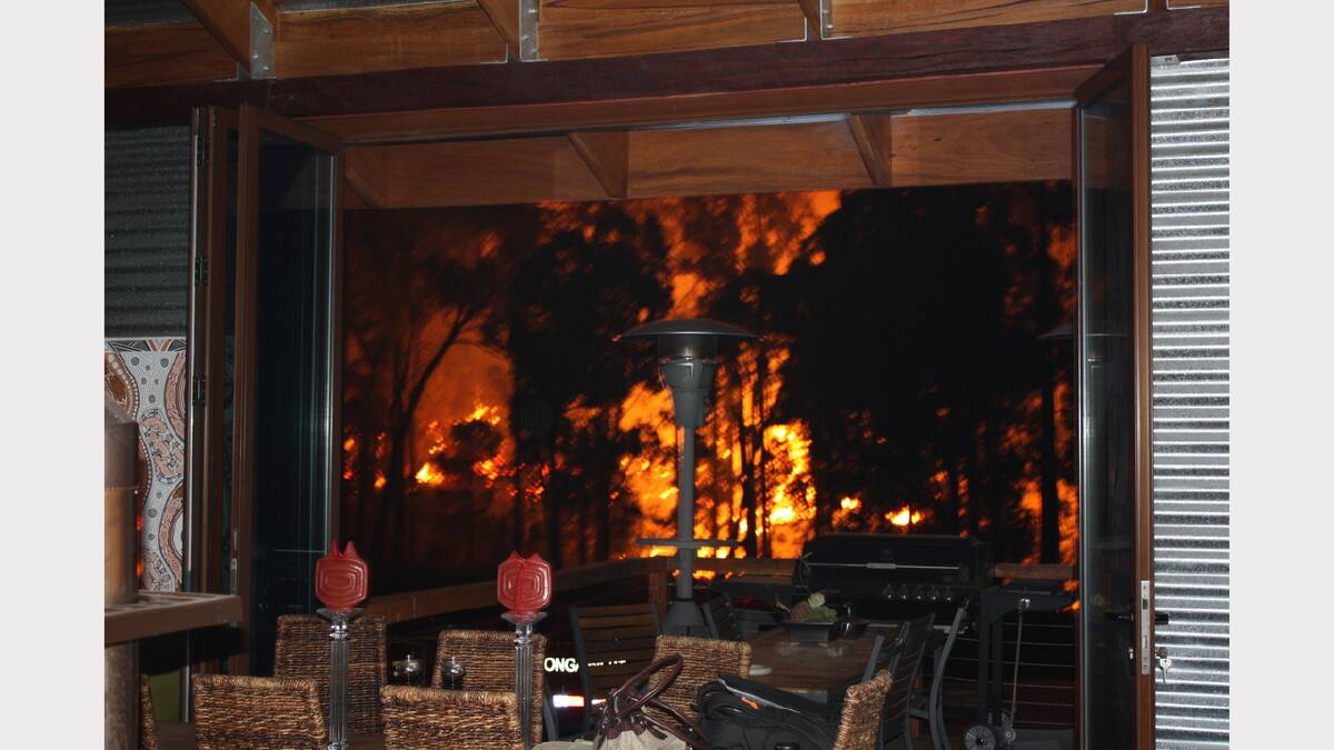 2009 February - Fire at a family's back doorstep in Stanley around Black Saturday. Picture: LEANNE HILLS