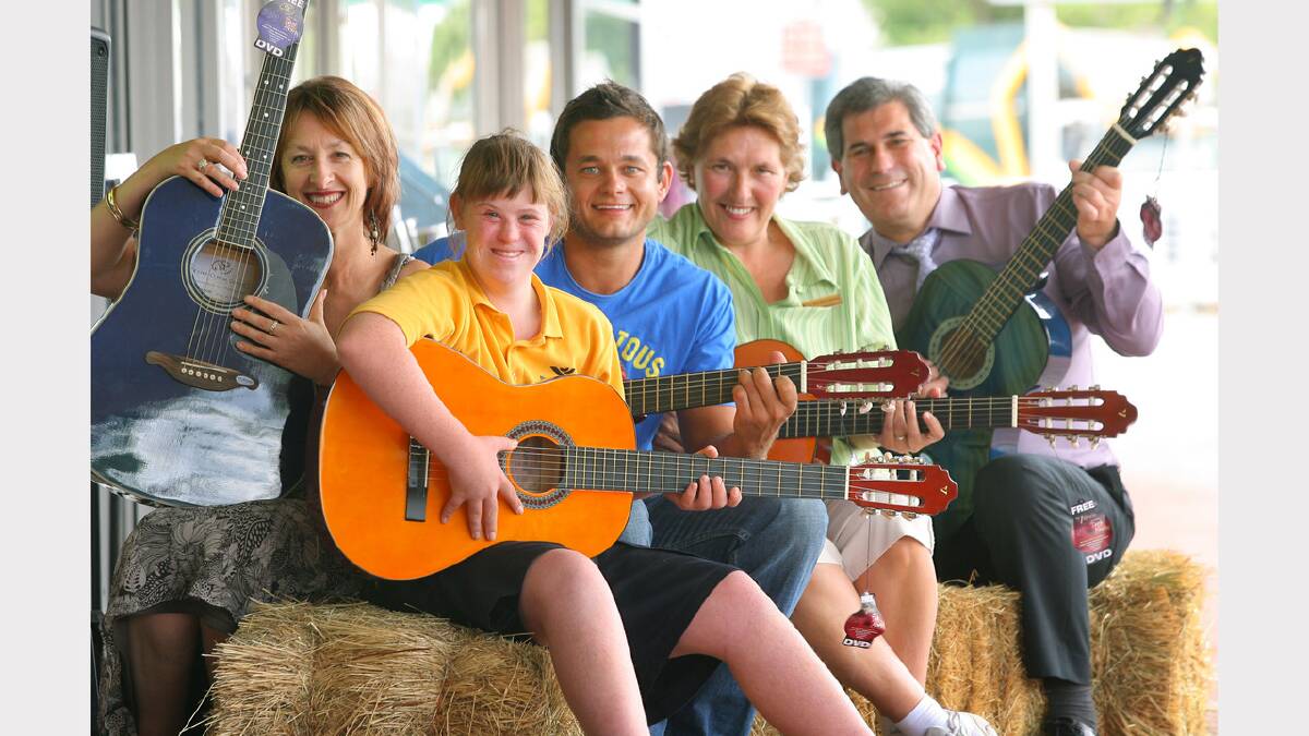 Kane Harrison, who won the Road to Tamworth country music competition, has used his $1000 prizemoney to purchase 20 guitars to donate to Belvoir and Wewak St schools. Picture: MATTHEW SMITHWICK