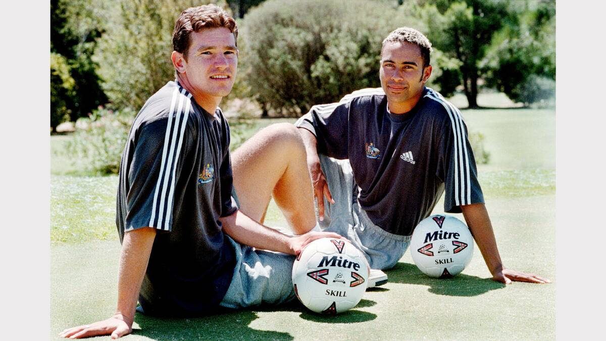 Albury's Peter Ritchie,  20, with Wodonga's Archie Thompson, 19, relax in between breaks at the Olyroos soccer training camp in Albury in 1998.