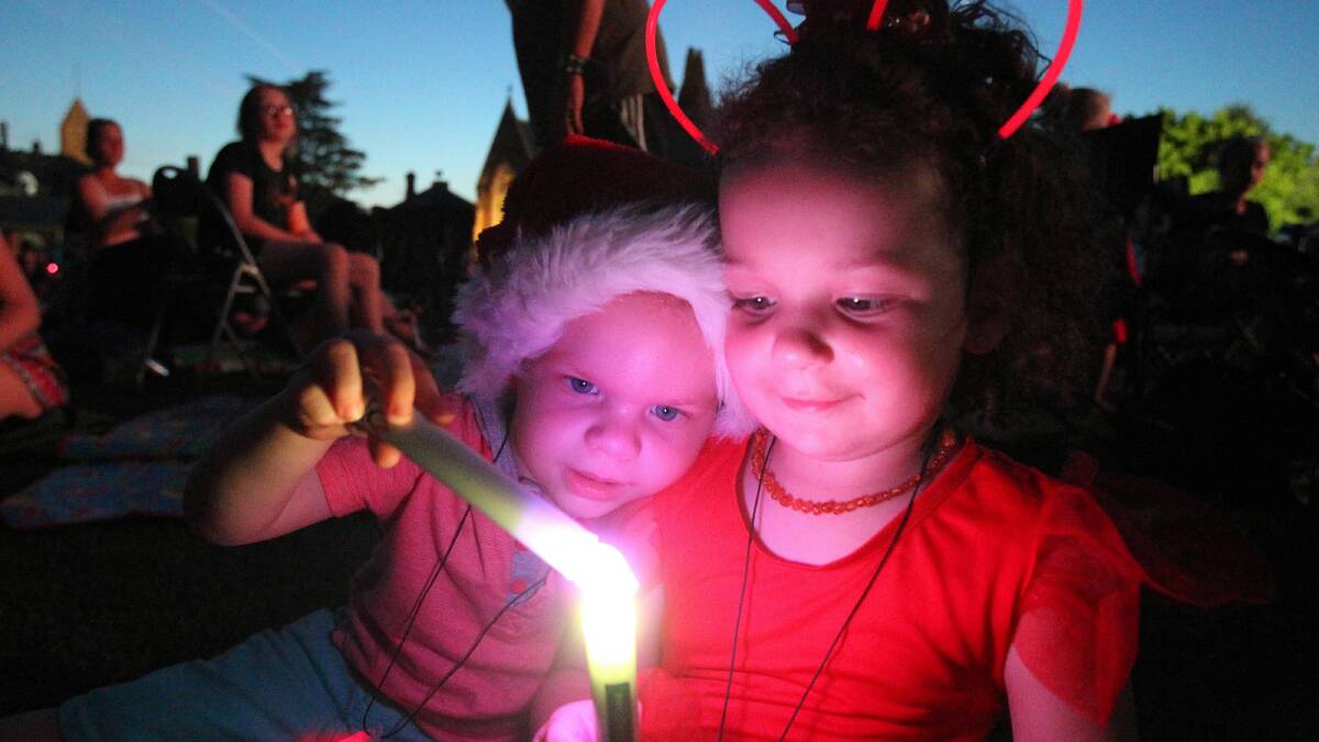 Jake Vincent, 2, and Charli Vincent-Marriott, , combine their candles on a warm night. Pictures: MARK JESSER