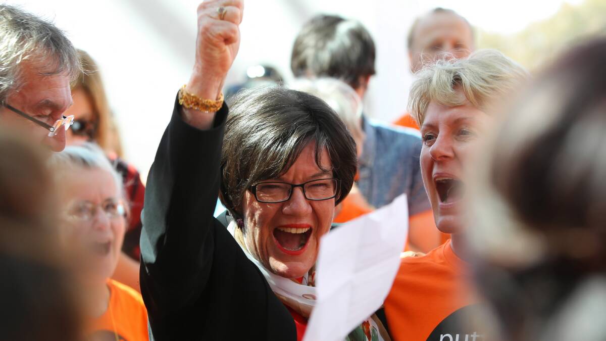  Member for Indi Cathy McGowan cheers with her supporters outside Parliament House, Canberra. Picture: MATTHEW SMITHWICK