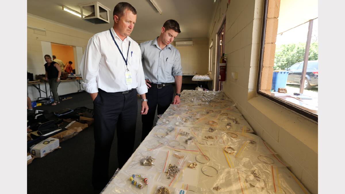 Detective Sen-Constable Matt Prestage, of Cobram CIU, and Sen-Constable Anthony Clifford, of Albury anti-theft unit, and some of the hundreds of items recovered. 
