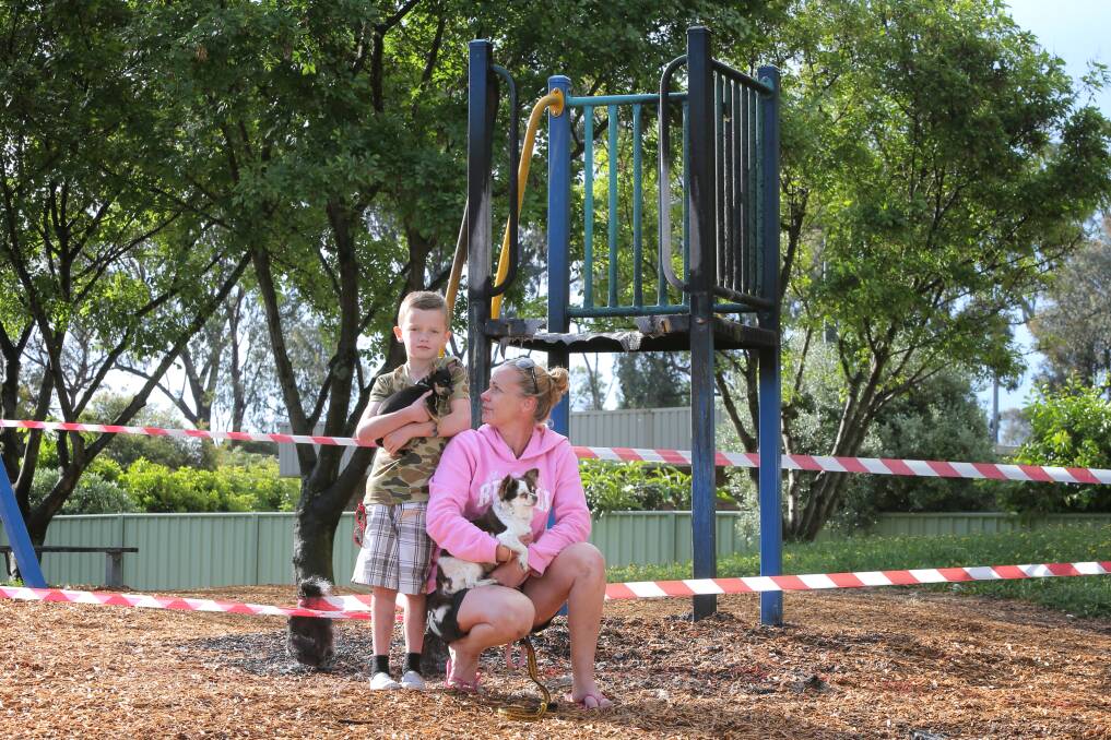 Blake Glover, 7,and his mum Sheridan Ingram, with their dogs Tilly and Coco, were disappointed kids would no longer be able to play at the park. 