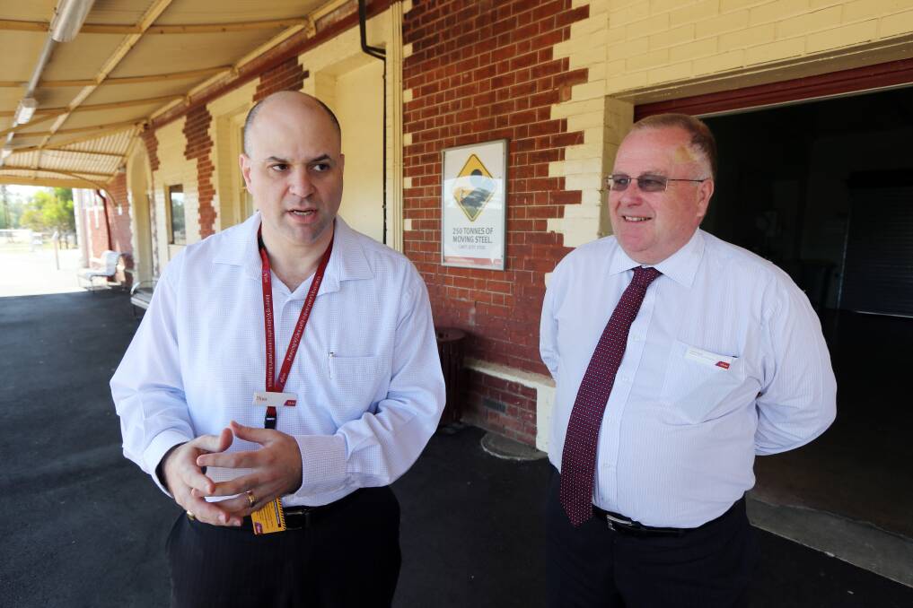 V/Line chief Theo Taifalos and marketing & communications manager Colin Tyrus speak to the press.