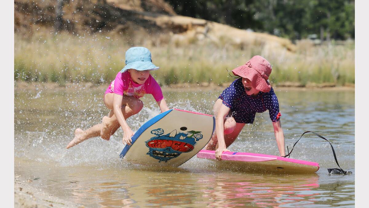 Sisters Clare,and Annabele Martinae, aged 7 and 10, race each other at Lake Sampbell, at Beechworth. 