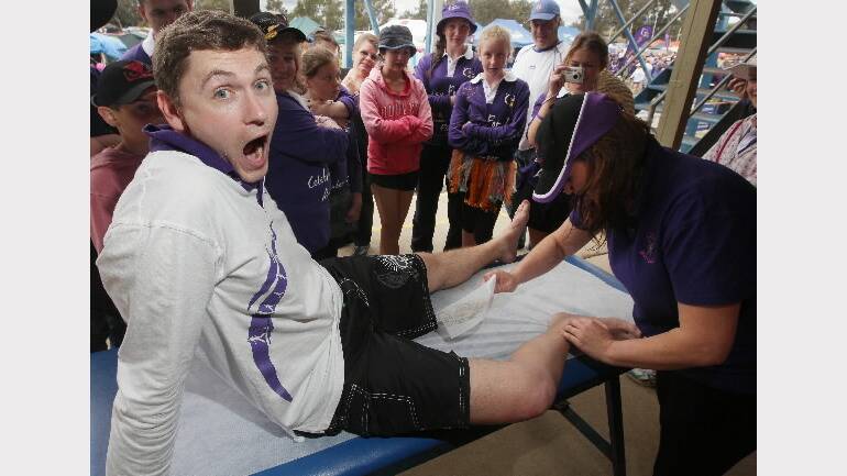 2010 -  Wodonga's Neil Thomson having his legs waxed by Wodonga's Larissa Kernaghan.