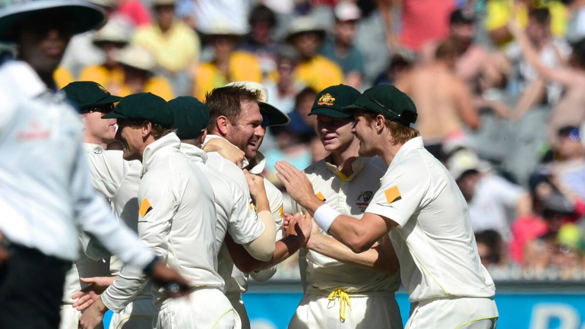 Ryan Harris celebrates with teammates after dismissing Ian Bell. Pictures: FAIRFAX