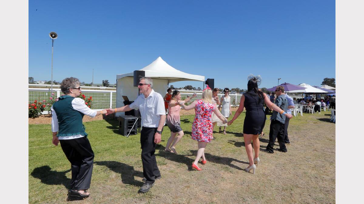 Racegoers have a dance to local duo Amanda Baxter and Scott Solimo.