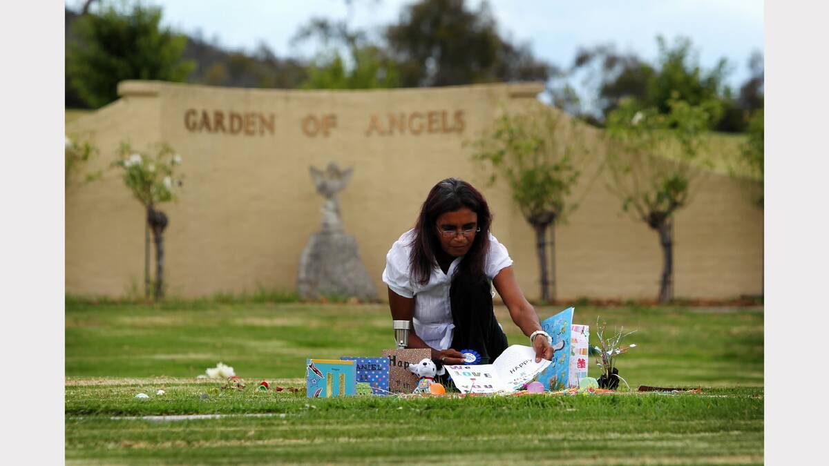 2012 - Donna Thomas places birthday cards on the grave of her son, Daniel Thomas, in the Glenmorus Memorial Gardens Albury, on what would have been Daniel's 11th birthday.