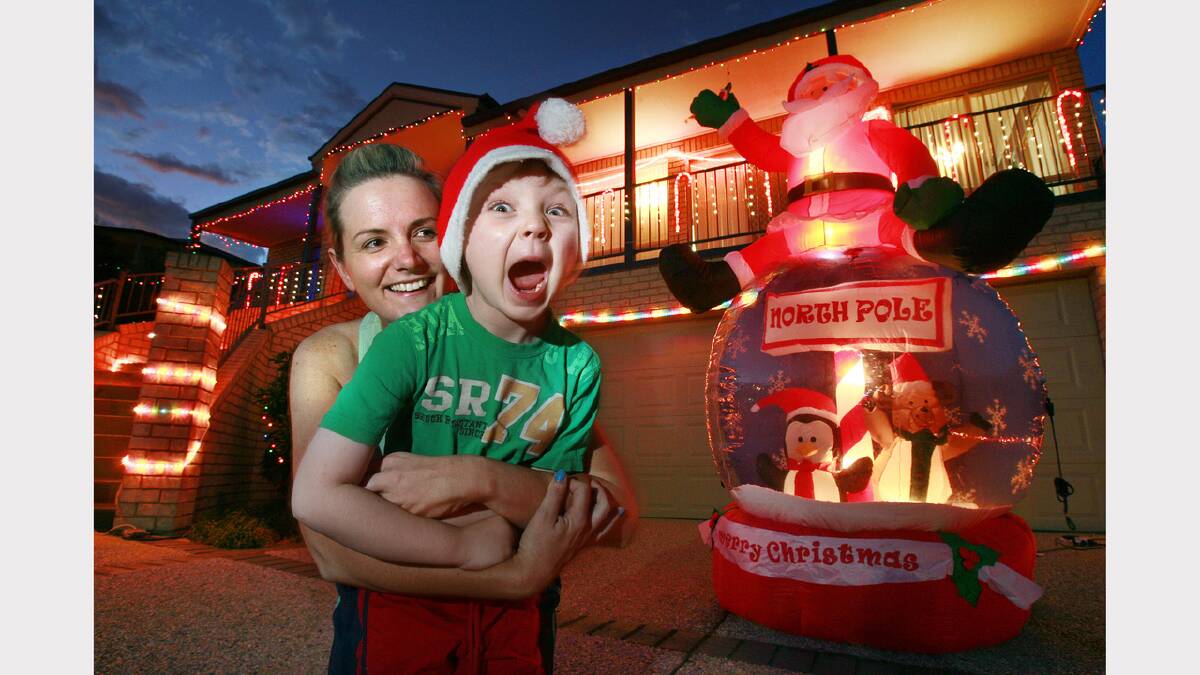 Tracey Phillips with son Codee, 5, with their Christmas lights display. Picture: KYLIE ESLER