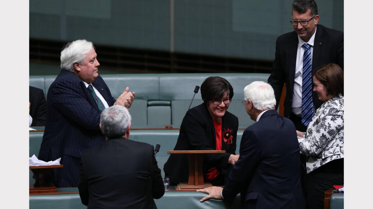 Members of Parliament congratulate Cathy McGowan after her maiden speech in Parliament House