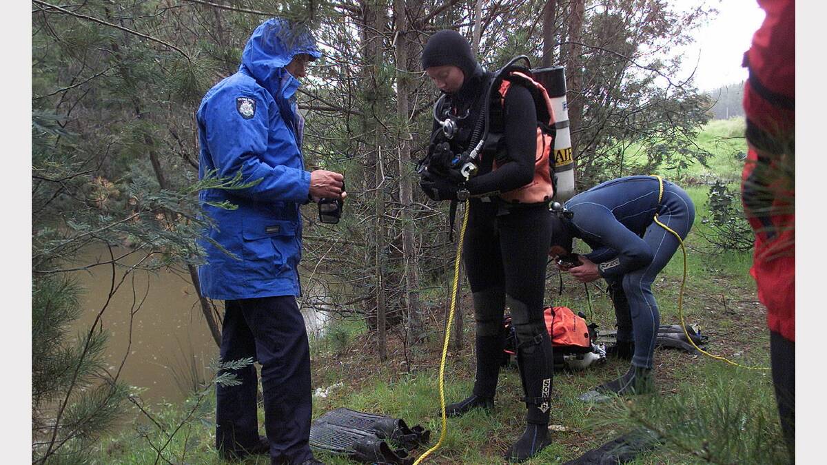 2003 - Sergeant Andrew Heardman helps Sen-Constable Bec Caskey get ready to do a dive and search the dam