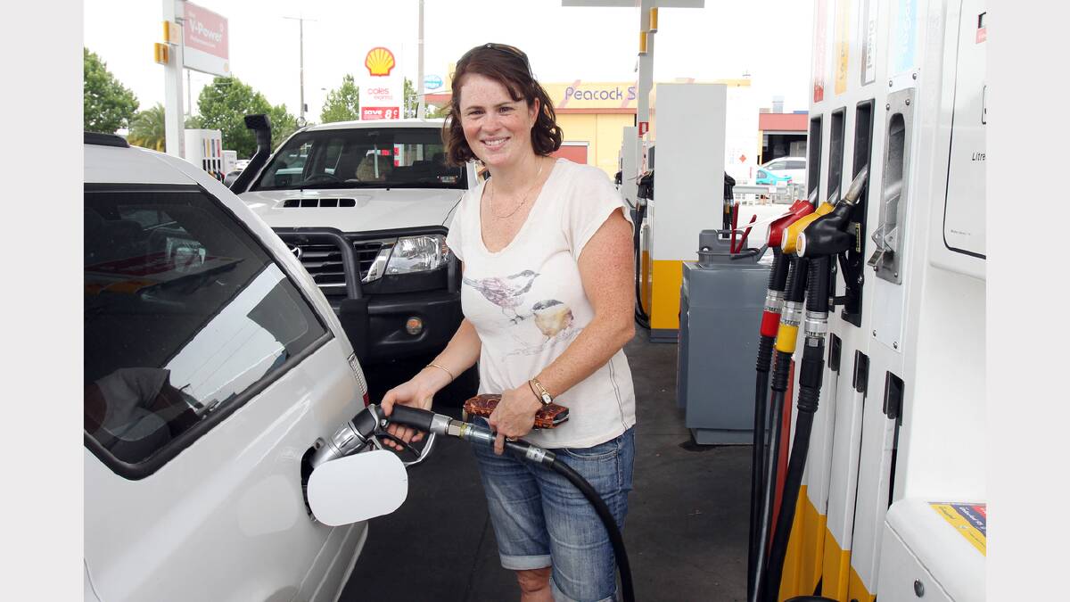 Chiltern's Erin Anderberg filling up with gas at Shell on Elgin Boulevard.