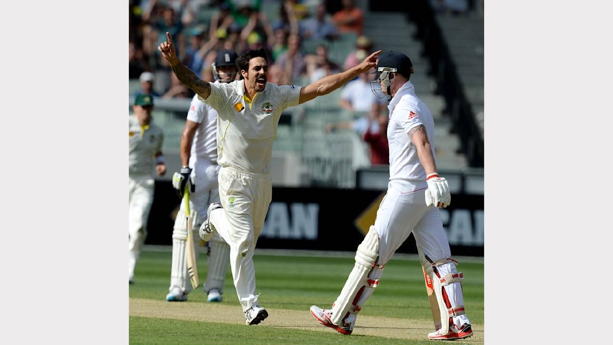 Mitchell Johnson celebrates the wicket of Ben Stokes.