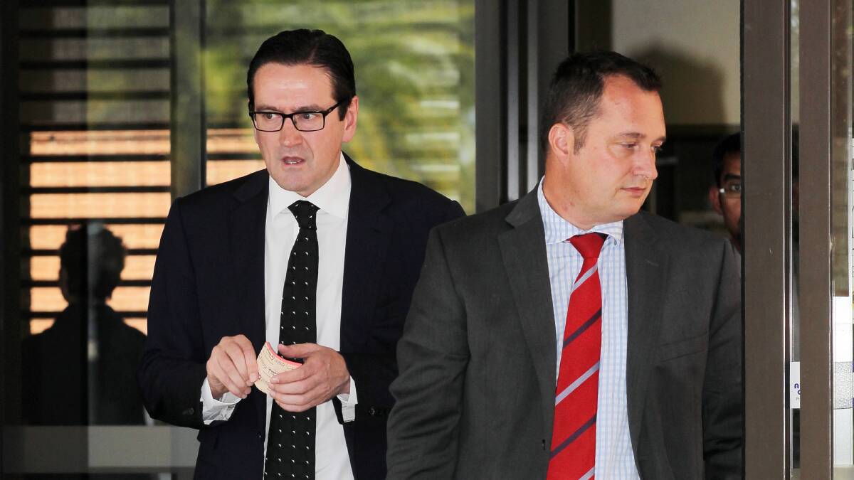 Albury urologist Jonathan Lewin outside Wodonga Court yesterday, front, with his solicitor Paul Halley.