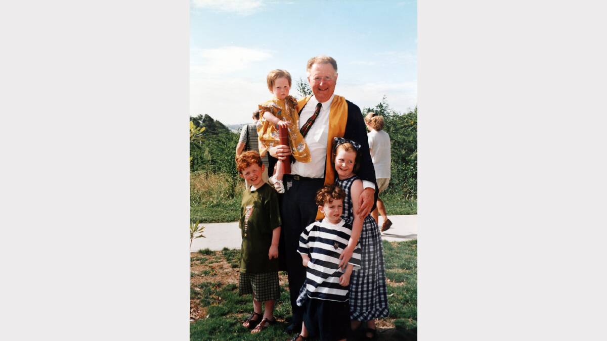 1996 - John Sykes on his graduation day at La Trobe University. He is pictured with his children (anti-clockwise from top) Isabella, Nicholas, Alexander, and Victoria.