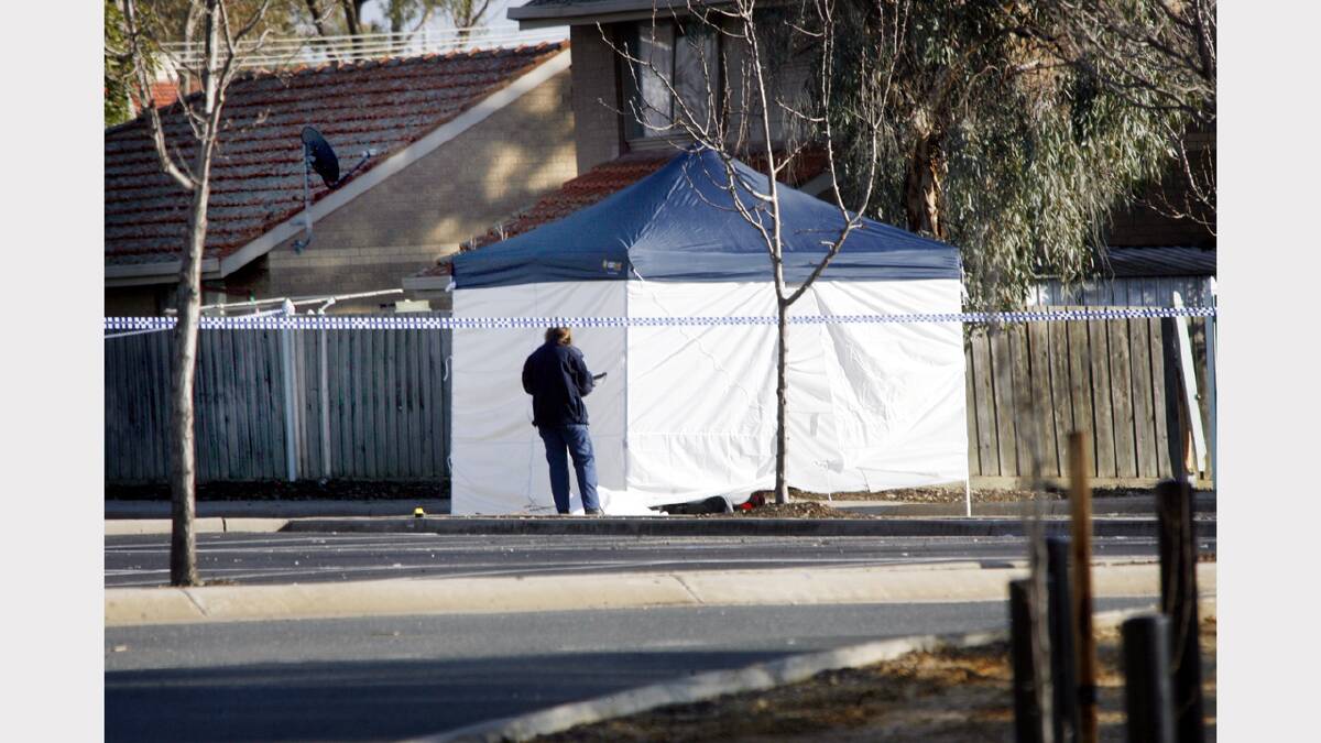 Police investigate the scene of Billy Winter's murder, at the Birallee Tavern.
