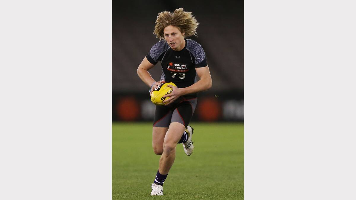  Eli Templeton of the Burnie Dockers runs with the ball during the 2013 AFL Draft Combine at Etihad Stadium. Picture: GETTY IMAGES