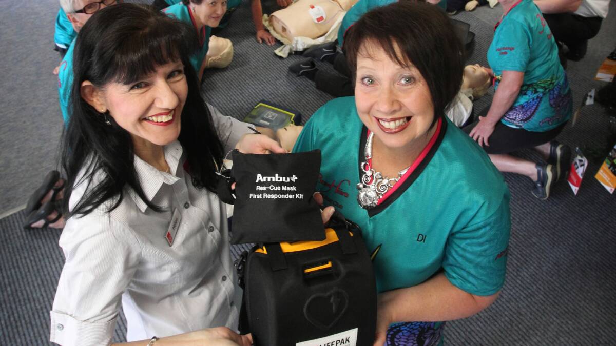 St John Ambulance Albury training centre co-ordinator Helen Chant and Brave Hearts on the Murray secretary Diane Laundess at a defibrillator training session. Picture: Mark Jesser
