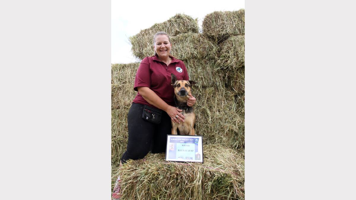 Winner of the Hay Bale jumping compeition (jumped 6 bales) Albury's Shari Shorrockwith 'Doc', a German Shepherd Kelpie Cross, after winning the Hay Bale Jumping competition. Doc jumped six bales.  