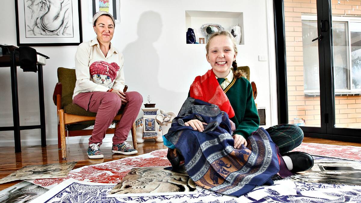 Kate Barrette Cummins and her daughter Millie Cummins, 11, will host an exhibition on Friday of Cambodian art to raise money for street children in that country. Picture: BEN EYLES