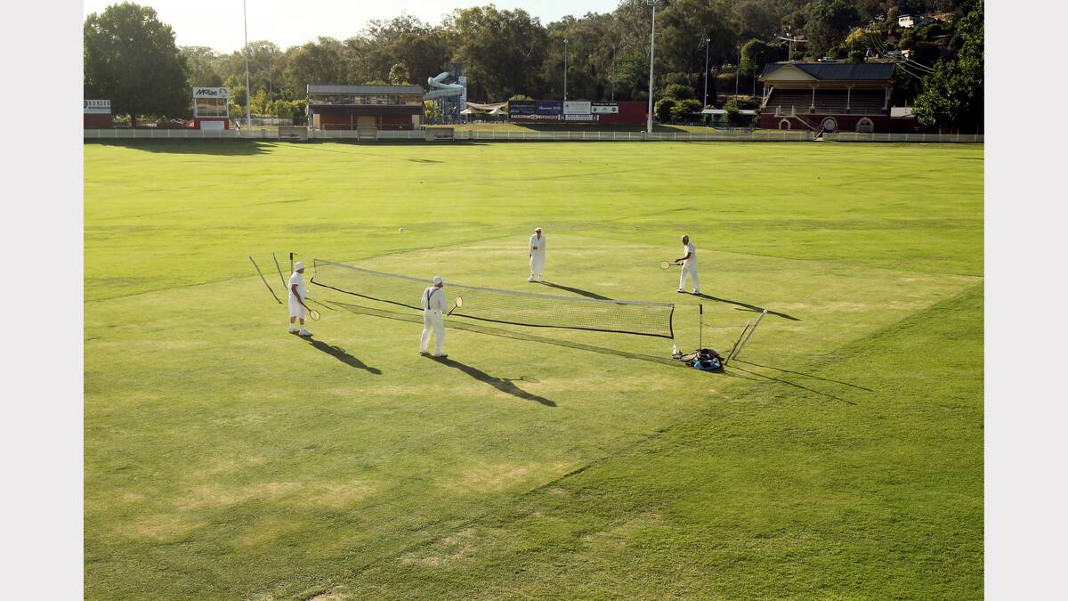  Beryl Bourk, Lona Johnstone, Roy Scholz and Wilf Scholz play in the middle of the oval at the Albury Tigers ground.