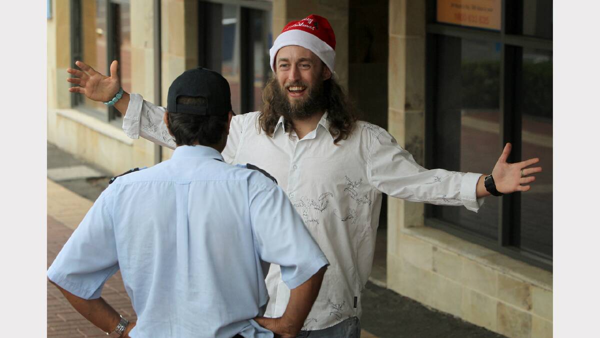 Teacher and author Ian Peric offering free hugs on Dean Street yesterday.