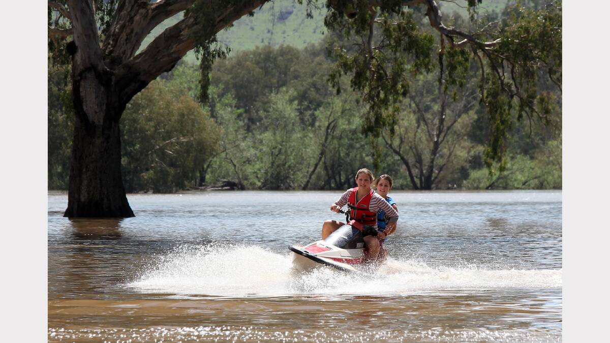 2012 - Walwa farmers use their jetski to check on cattle during the floods.