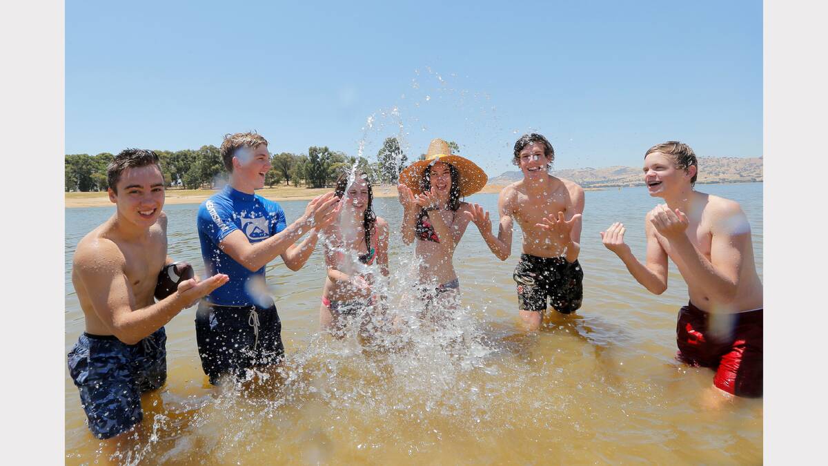 Joshua Pan, 16,Joel Grimmond, 16, Sophie Wegener, 16,Tia Grant, 16, Mitch King, 17, and Jacob Robb, 16, cooling off in Lake Hume. Picture: TARA GOONAN