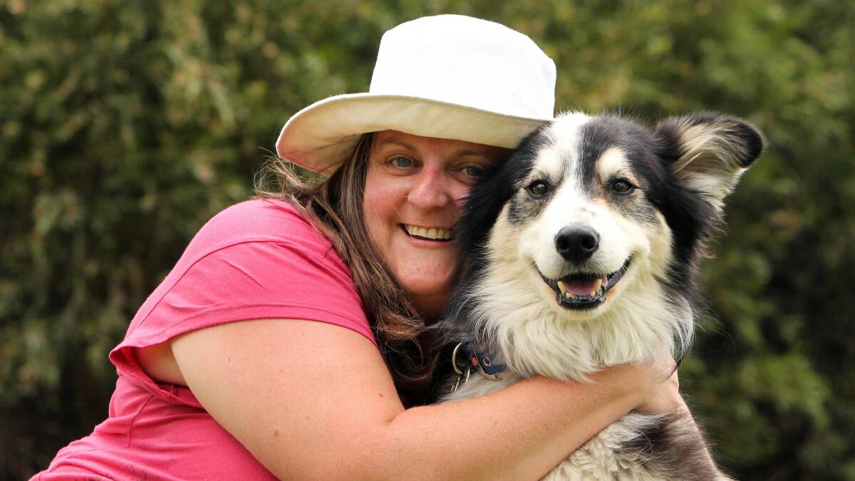 Carolyn Morley hugs Archie, judged “the most unusual looking dog” at Albury’s Pets Day Out at Hovell Tree Park. Pictures: MARK JESSER  