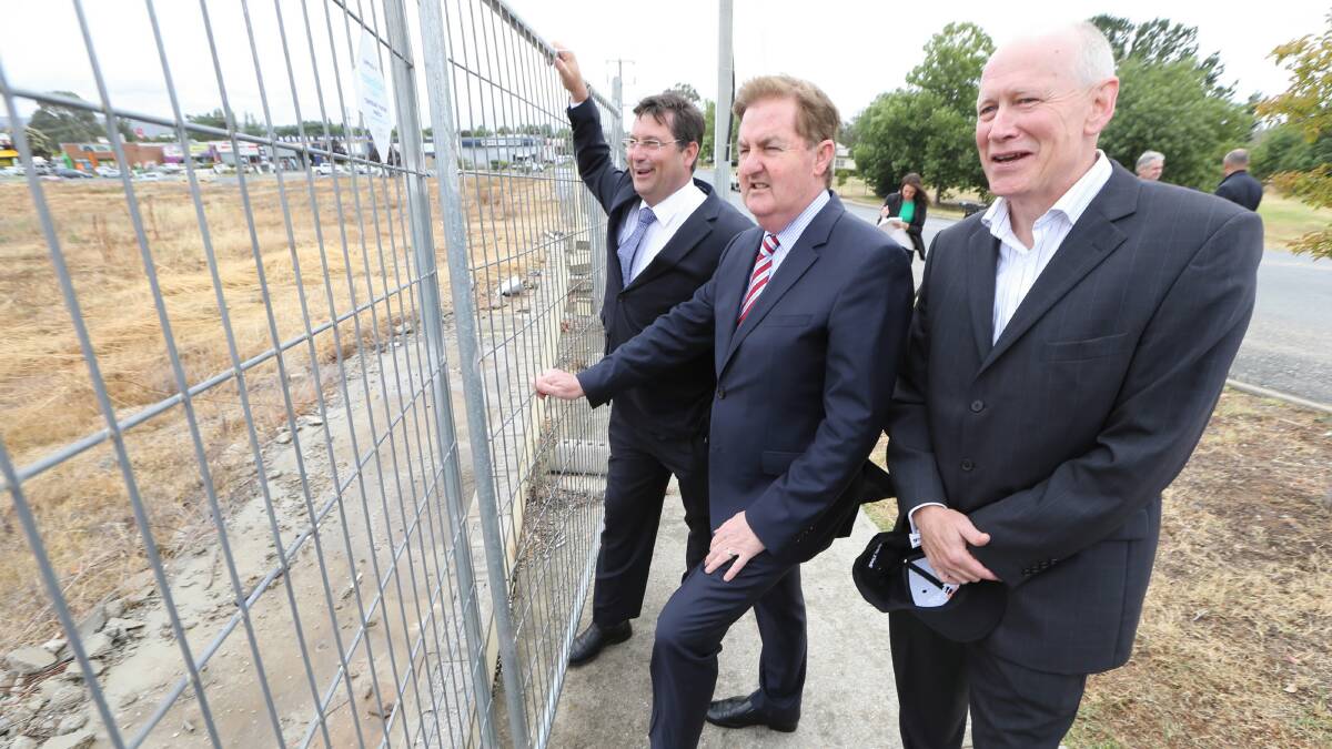 Deputy Premier of Victoria, Peter Ryan, examines the proposed Mann shopping centre site with Benambra MP Bill Tilley and Chris Mills of the Manns Building Group. Picture:  JOHN RUSSELL