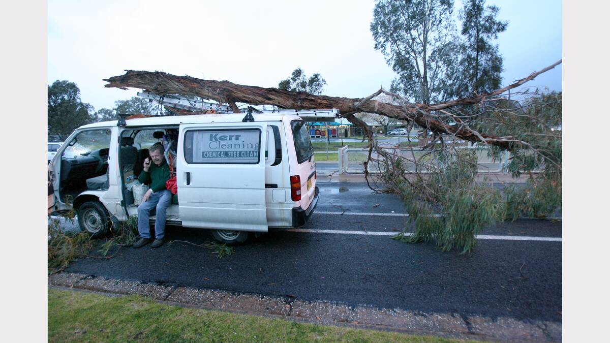 Harry Kerr heard a branch fall on the roof of his car but didn't realise how big it was until he got out and had a look. Wodonga. August, 2008
