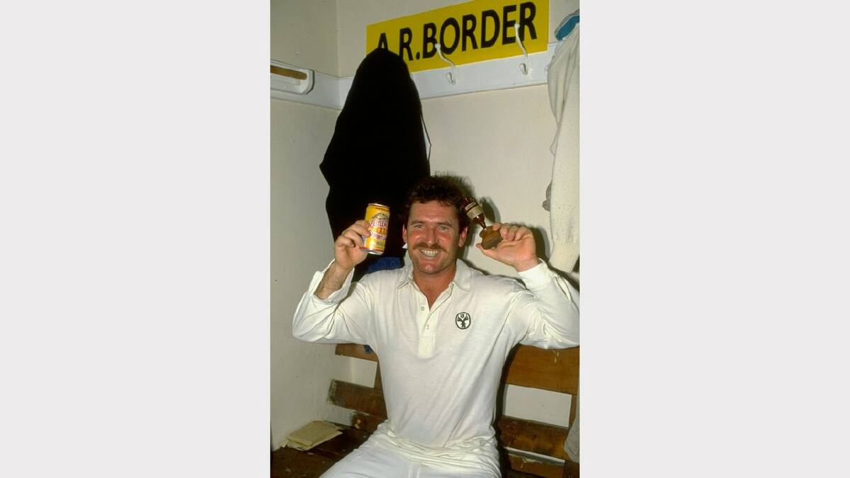 Allan Border of Australia holds up the ashes in the dressing room. Picture: ALLSPORT