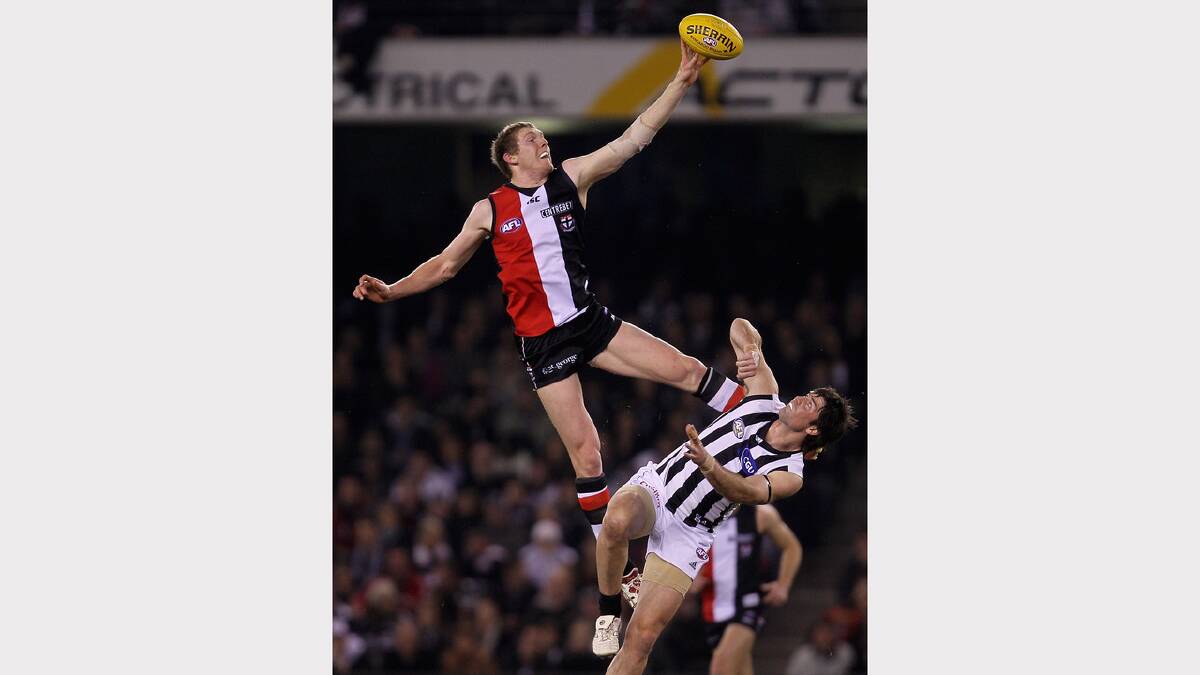 Ben McEvoy of the Saints wins a ruck contest against Leigh Brown of the Magpies. Picture: GETTY IMAGES
