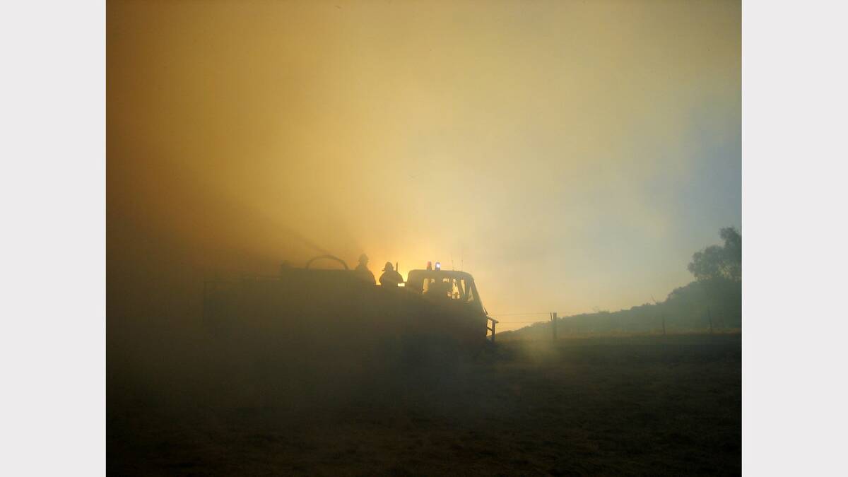 2006 February - Firefighters at a bushfire between Tarcutta and Holbrook. Picture: LESLEY FORD