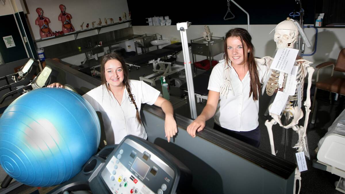 Sacred Heart College year 11 students Annie Wilson and Abbey Lawless inspect the new equipment at the official blessing and opening of the Sacred Heart College facilities. Picture: DYLAN ROBINSON