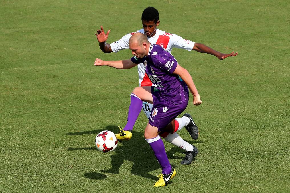 Glory's Steven McGarry and Heart's Golgol Mebrahtu contest the ball during a match in October last year. Picture: GETTY IMAGES