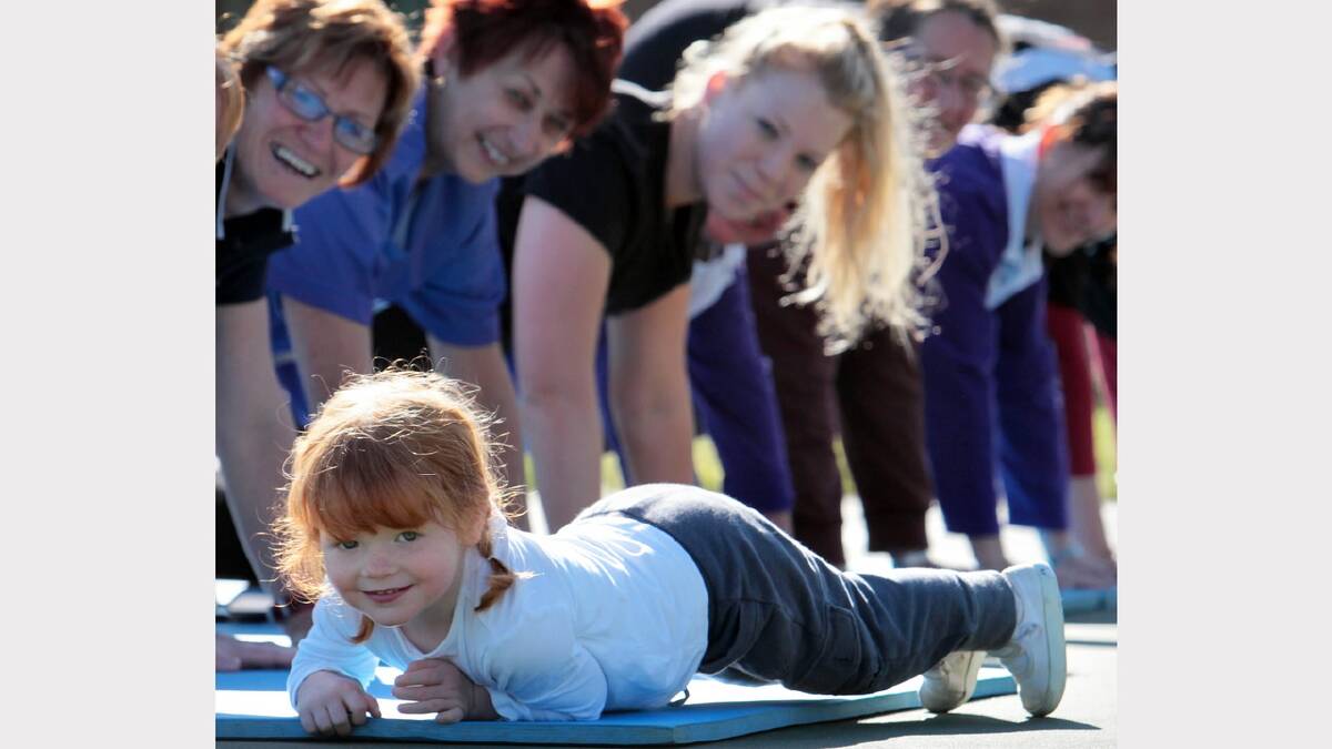 2011 - Chloe Duffy, 3, practiced doing the plank with her mum's team, who were attempting the world record at the Relay for Life. 