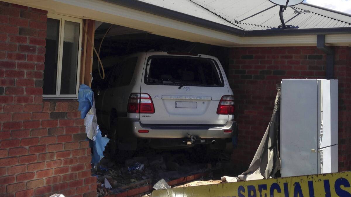 A Toyota LandCruiser has smashed into a Wodonga home, causing extensive damage. Pictures: CHLOE BOOKER